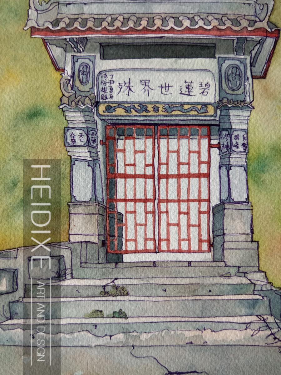An ancient doorway in china with pillars and scriptures